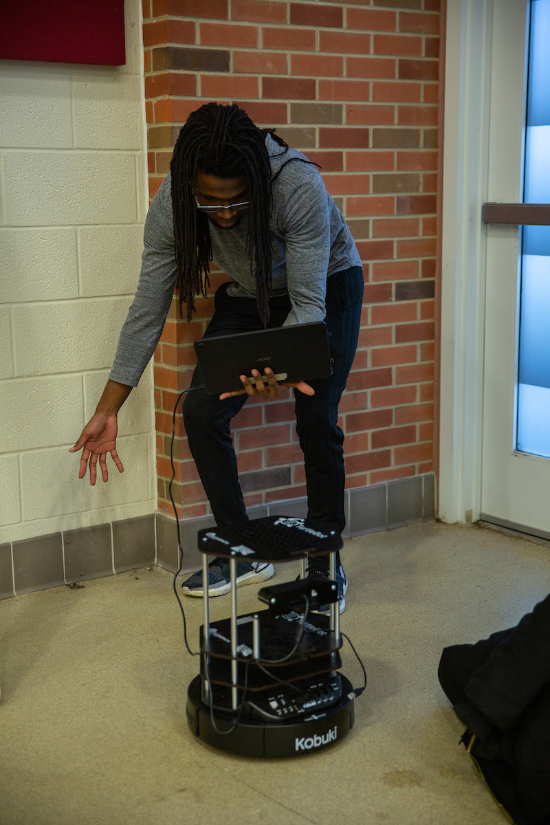 An Austin Peay State University Robotics II student tests the computer vision of a TurtleBot II during class.