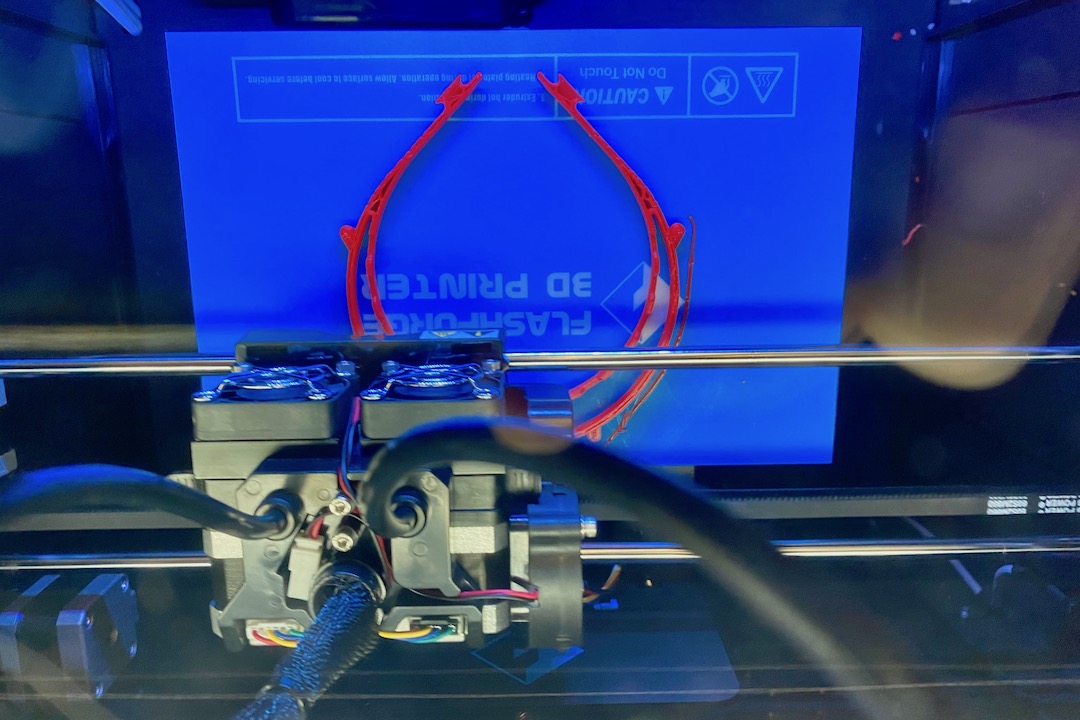A 3D printer creates one of the face shield frames at APSU’s GIS Center.