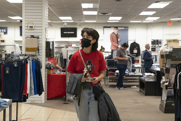 A student shopping for clothes inside JCPenney