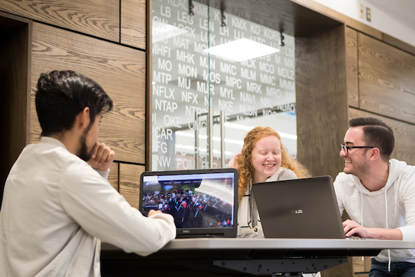 Students talk stocks in the new trading center