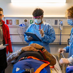 Students during simulation reviewing chart for patient
