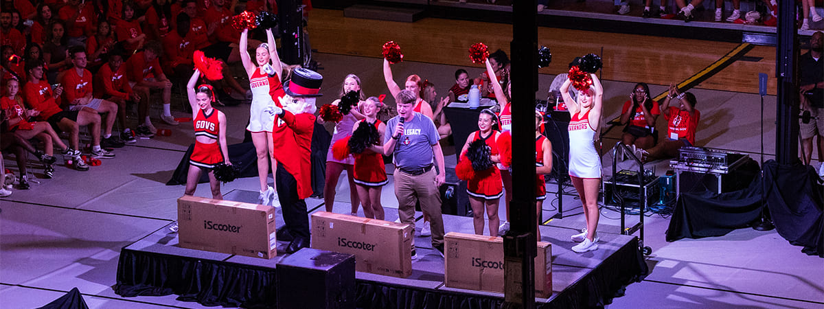 APSU Cheerleaders and Dancers on stage with the Gov mascot and event leaders calling out new student giveaway winners.