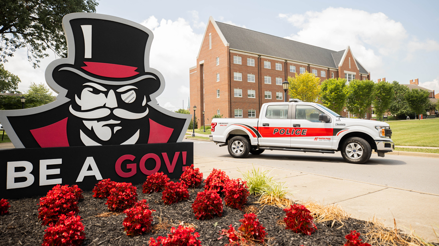 APSU Campus Police Truck parked next to the Be Gov Sign on Drane Street