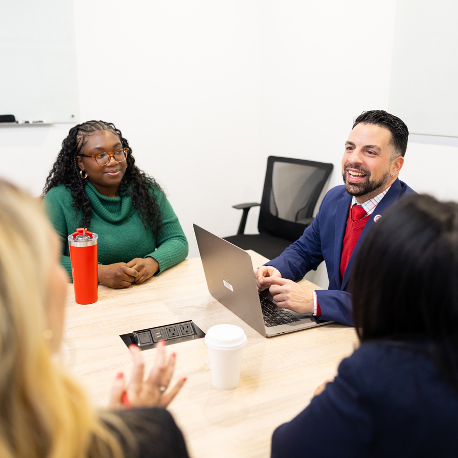 Group of Graduate students discussing their class