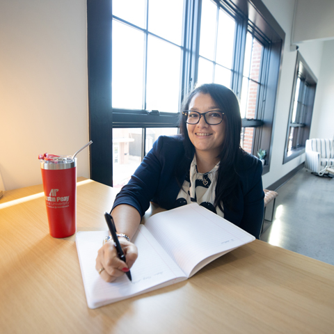 Graduate Student taking notes