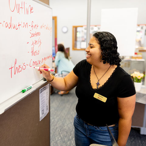 Student working on a whiteboard