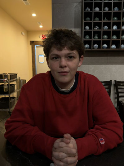 James Hinson sitting in a restaurant.