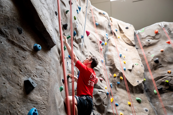 Student rock climbing at the Foy Fitness Center